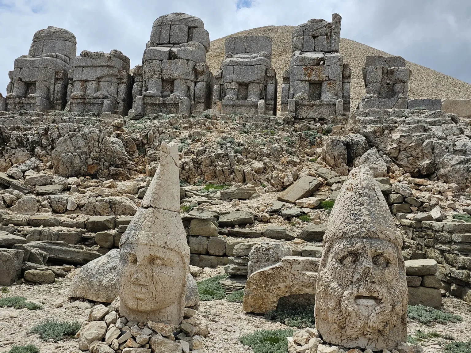 Ancient stone heads and statues at Mount Nemrut archaeological site in Turkey